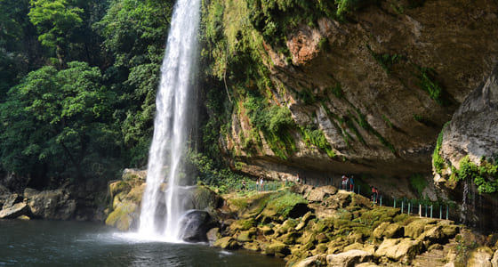 Walking behind the falls at Misol-Ha