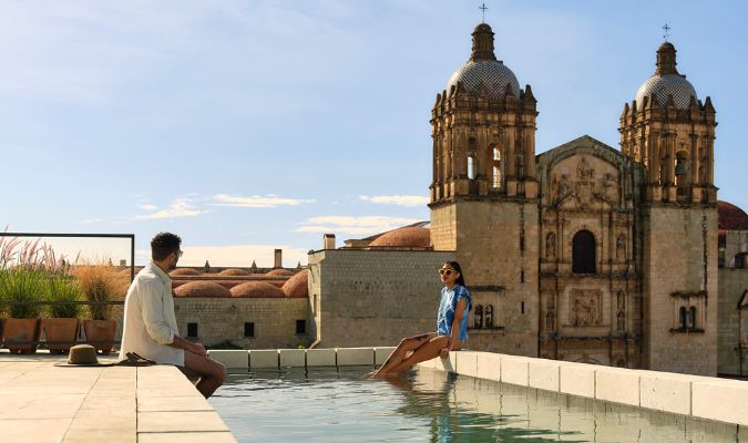 otro oaxaca couple enjoying pool