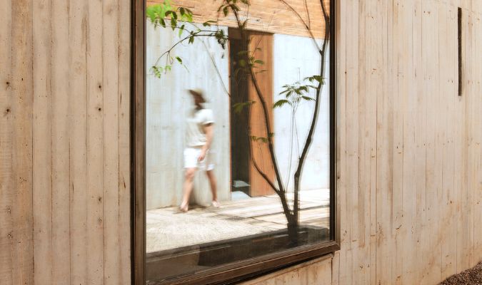 otro oaxaca man walking in front of mirror