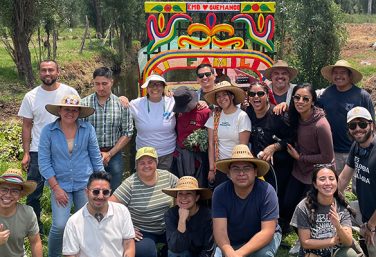 volunteer in mexico city xochimilco infront of trajinera