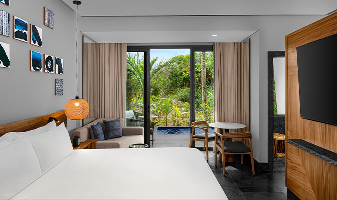 conrad-tulum-tropical-view-suite-king-bed